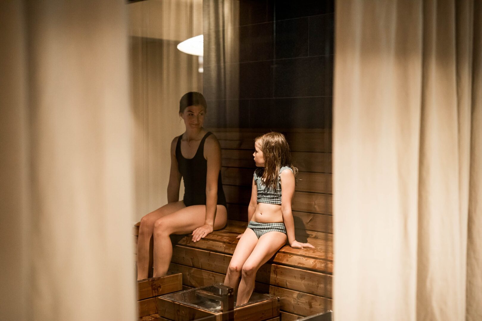 mother and daughter taking a foot bath