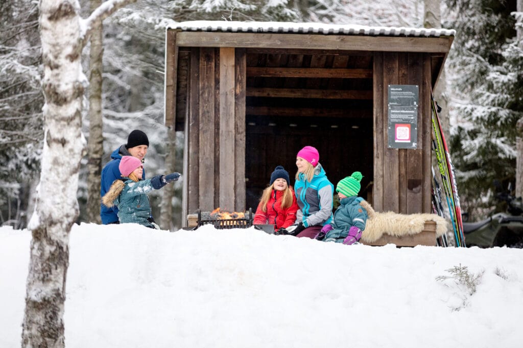 A family in the snow on the mountain Billingen